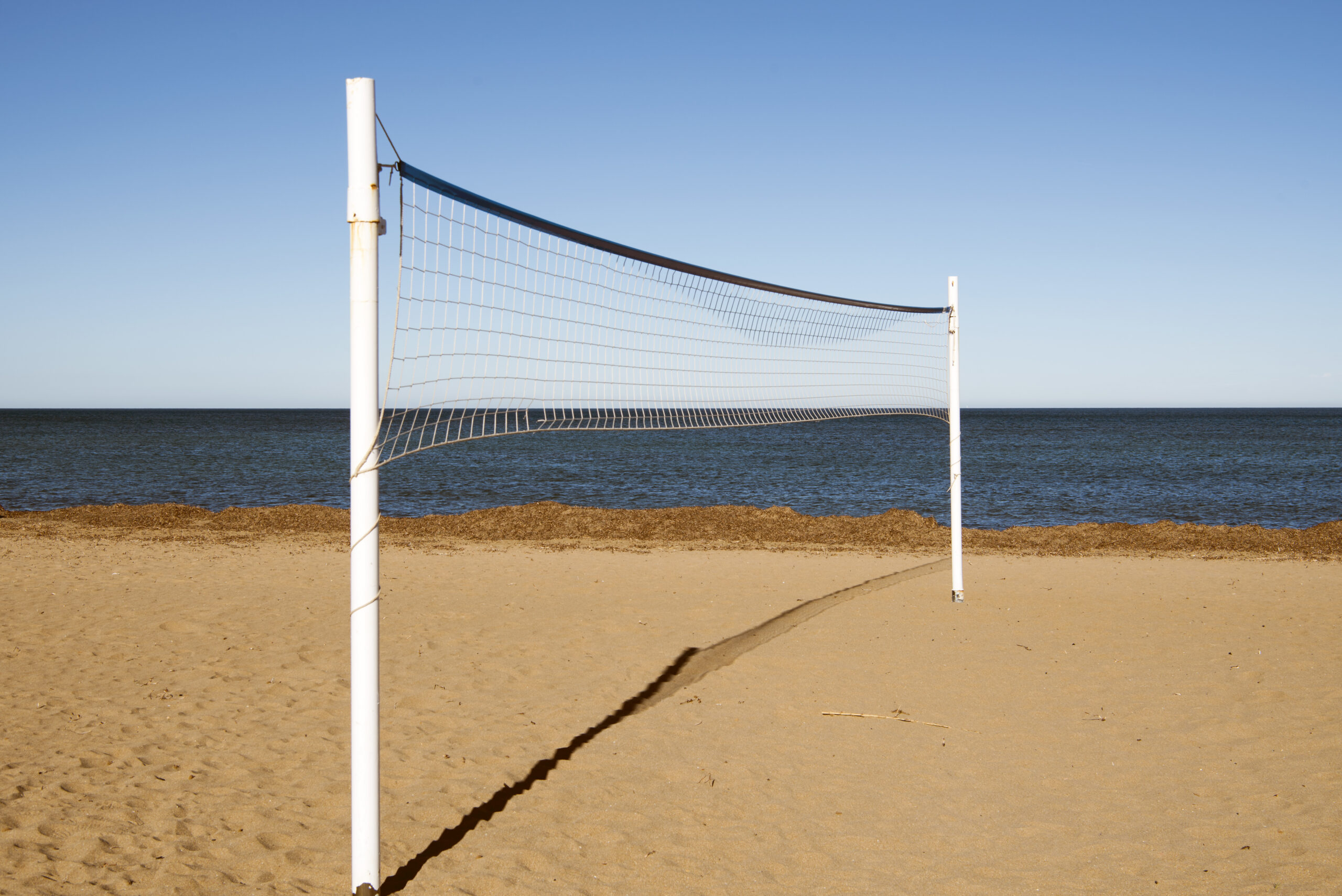 Beach volleyball court construction and sand installation